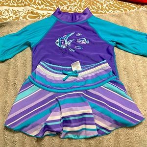 Im selling a two piece swimsuit worn ones size 6 girls the color is purple/blue